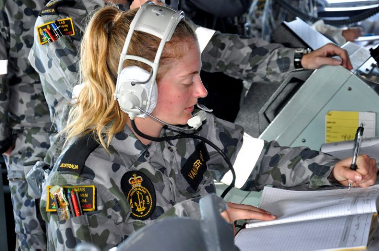 Seaman Communications Information Systems Melissa Vanderley recording log entries on the bridge of HMAS Darwin, during Exercise Ocean Protector 17.